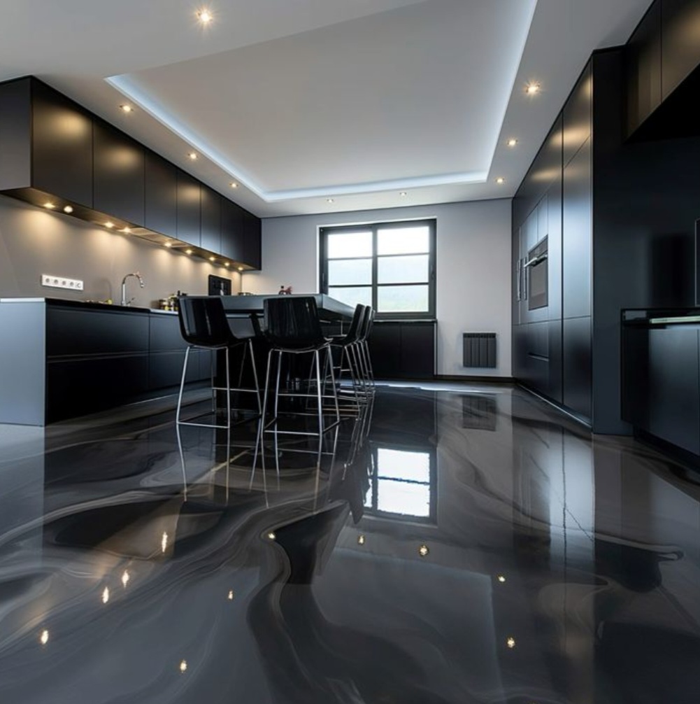 Sol sombre aux effets marbrés et aux reflets brillants dans une cuisine contemporaine.